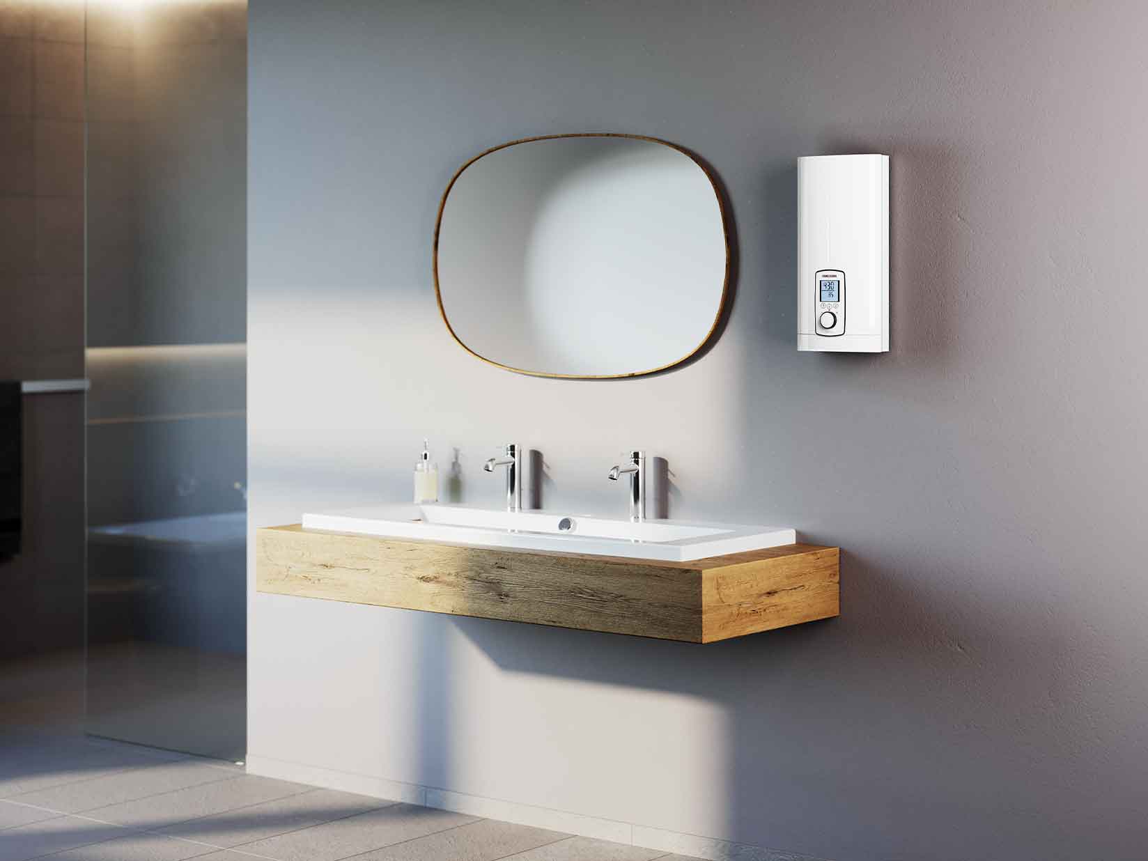 Ein Durchlauferhitzer von STIEBEL ELTRON ist an der Wand eines modernen Badezimmers installiert.